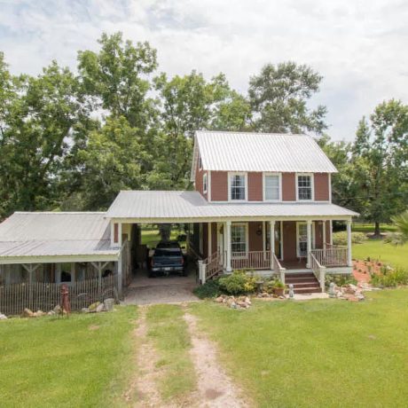 View of Charming Farmhouse at Green Woods Stables RV Park