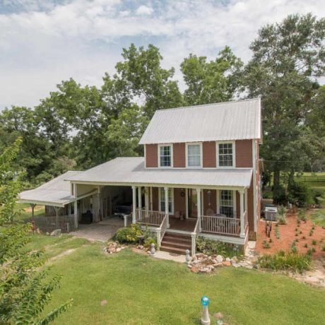 View of Charming Farmhouse at Green Woods Stables RV Park