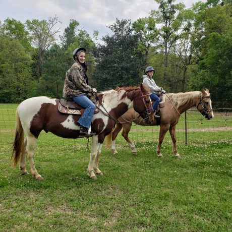 people riding horses on trails at Green Woods Stables RV Park