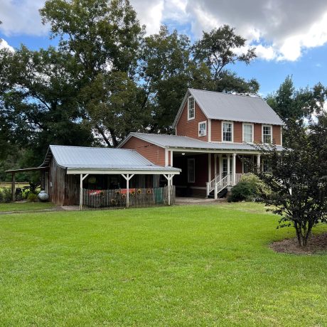 View of Charming Farmhouse at Green Woods Stables RV Park